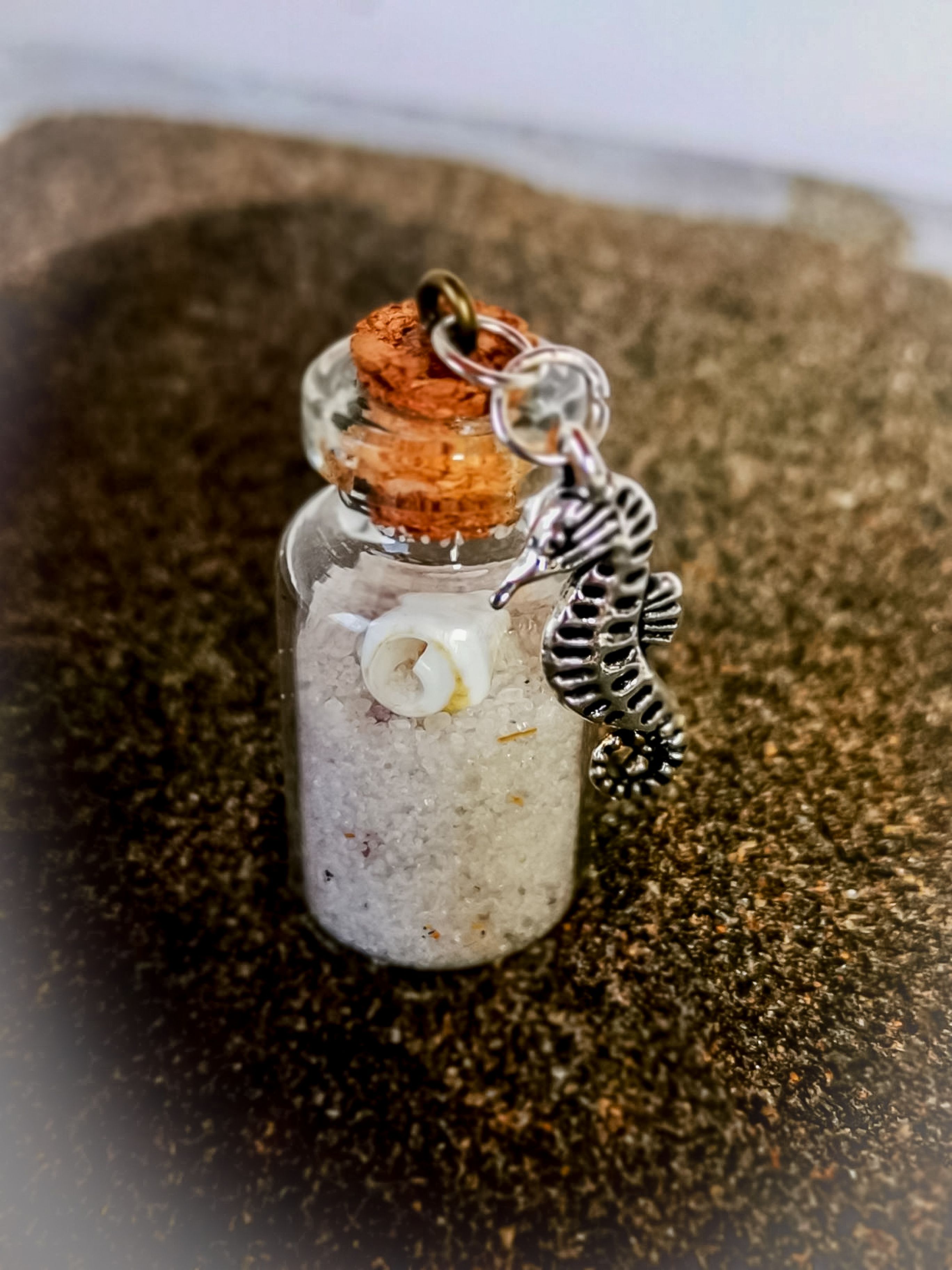 Glasfläschchen mit Seepferdchen