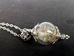 Glaskugel mit Pusteblume